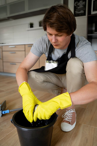 man-servant-cleaning-house