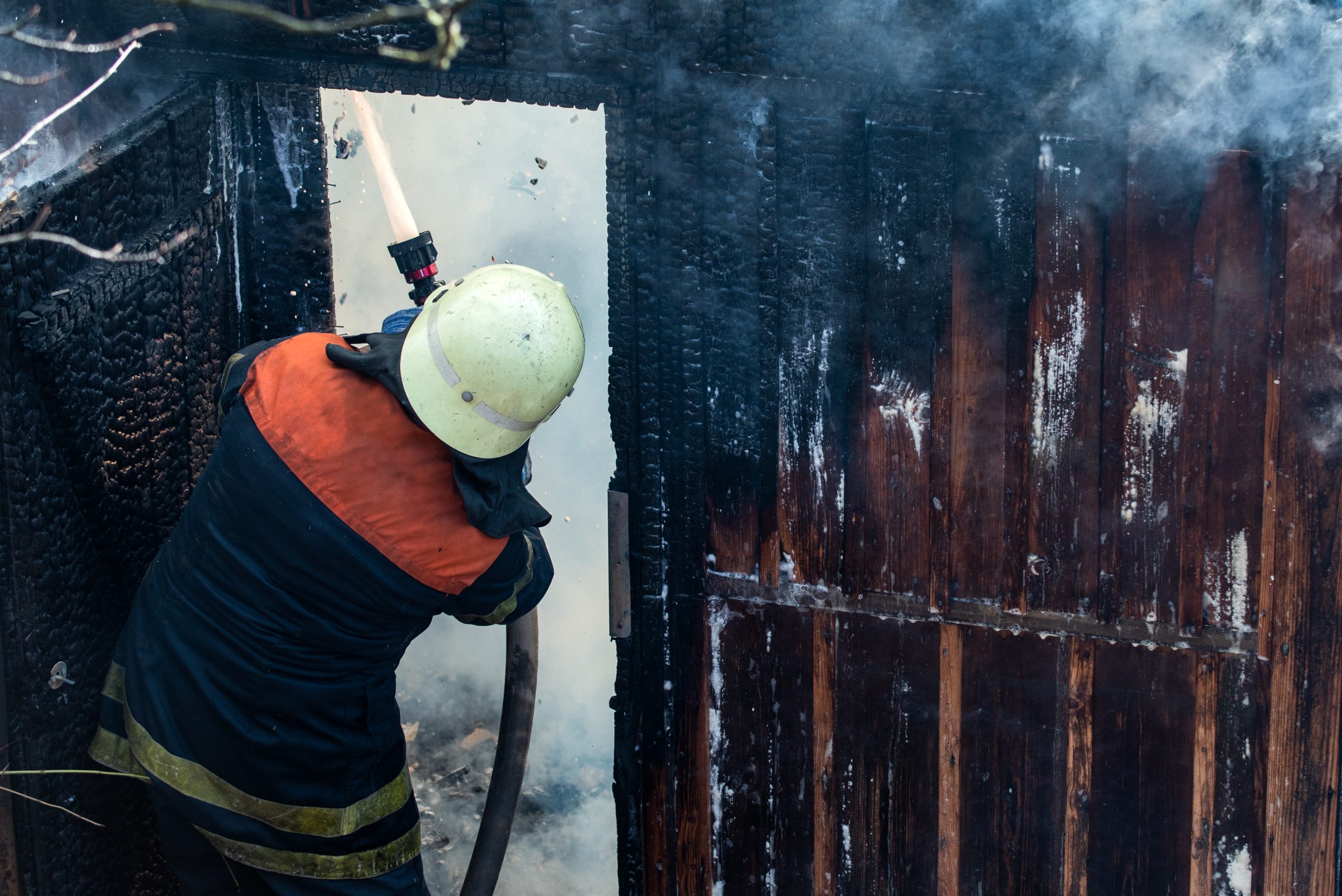 full-shot-man-working-as-plumber Fire & Smoke Damage Repair Experts